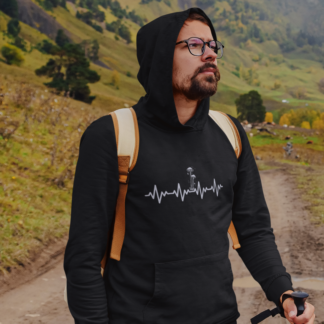 man wearing black plant medicine mushrooms hoody