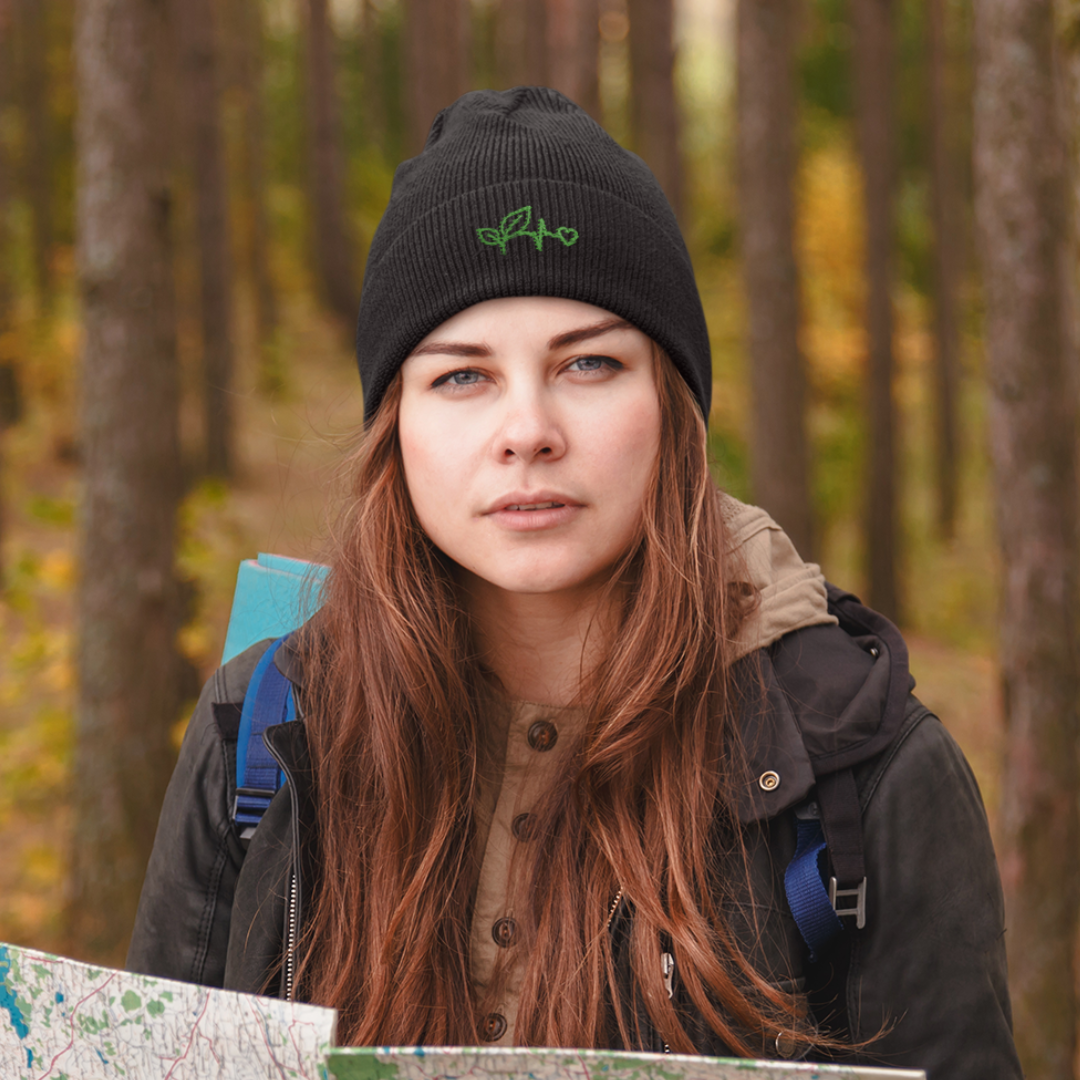 girl wearing black plant medicine hat