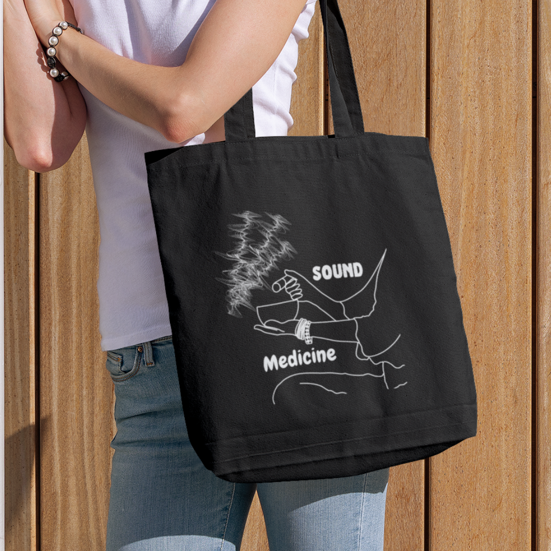 lady carrying sound healing black organic tote bag