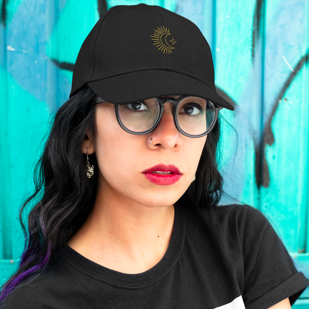 girl with nose ring wearing embroidered moon black organic cotton cap