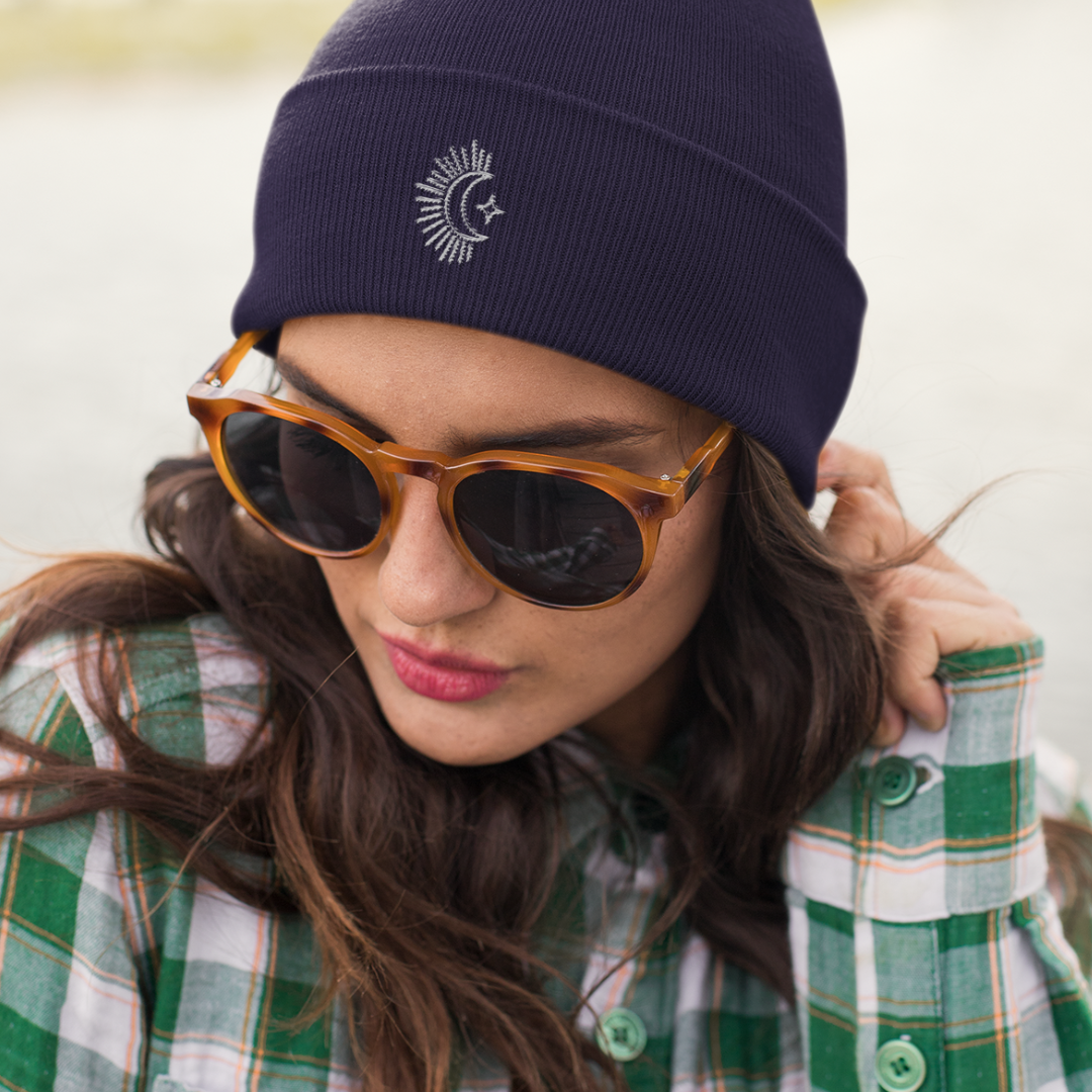 woman wearing embroidered navy moon beanie hat