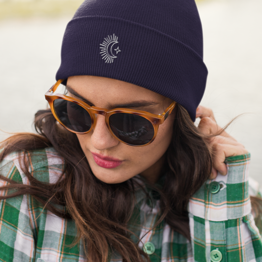 woman wearing embroidered navy moon beanie hat