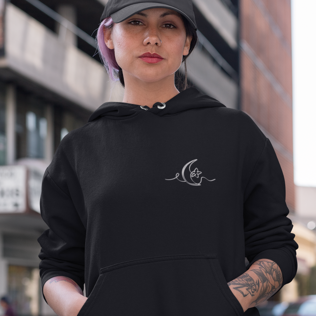 woman wearing black embroidered moon hoody