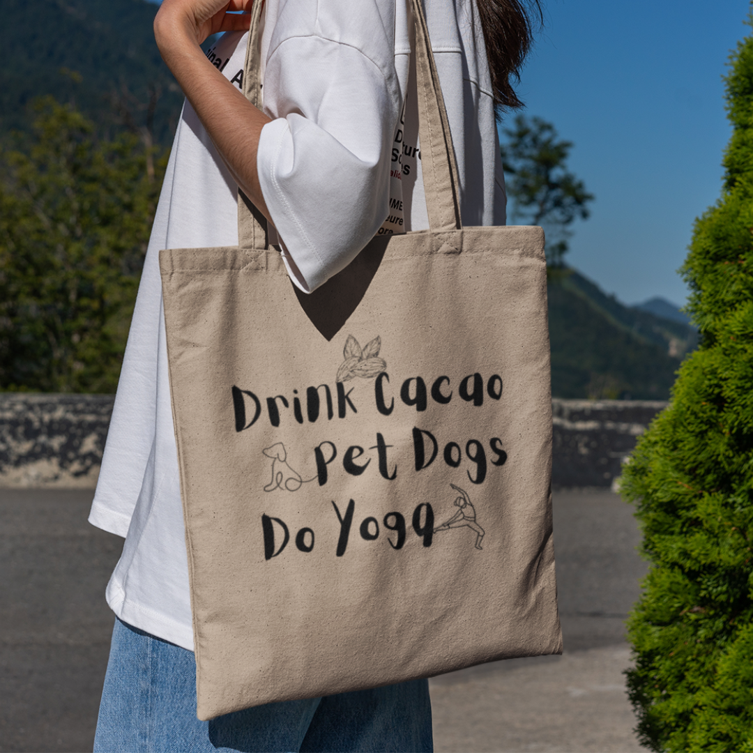 woman carrying a cacao, dogs and yoga tote bag in nature